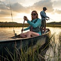 Old Town Discovery Sport 15 canoe being paddled on a lake