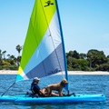 Hobie Adventure Island Sailing with Trampoline Set on the Outriggers