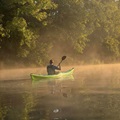 Paddling the Design Kayaks Unplugged sea kayak on an estuary