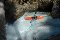 A paddler using the Pyranha Scorch X kayak on a white water creek